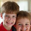 Portrait of a young family smiling.